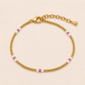 AURA gold beaded bracelet with pink and white accent beads, lobster clasp and extender chain